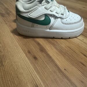 Nike White Leather Sneaker with Green Swoosh